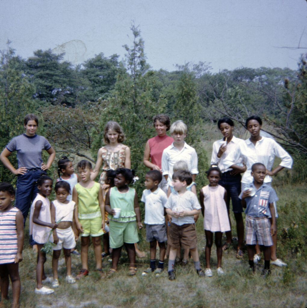 little carl first photoHead start with Mom Lucy LIza me and kids 2 My mother’s summer camp in Water Mill. Left to right: sisters Lucy and Liza Little, my mother, Patsy Little, me, Dorothy and Diana Davis, and the campers. Photo by Jack Little